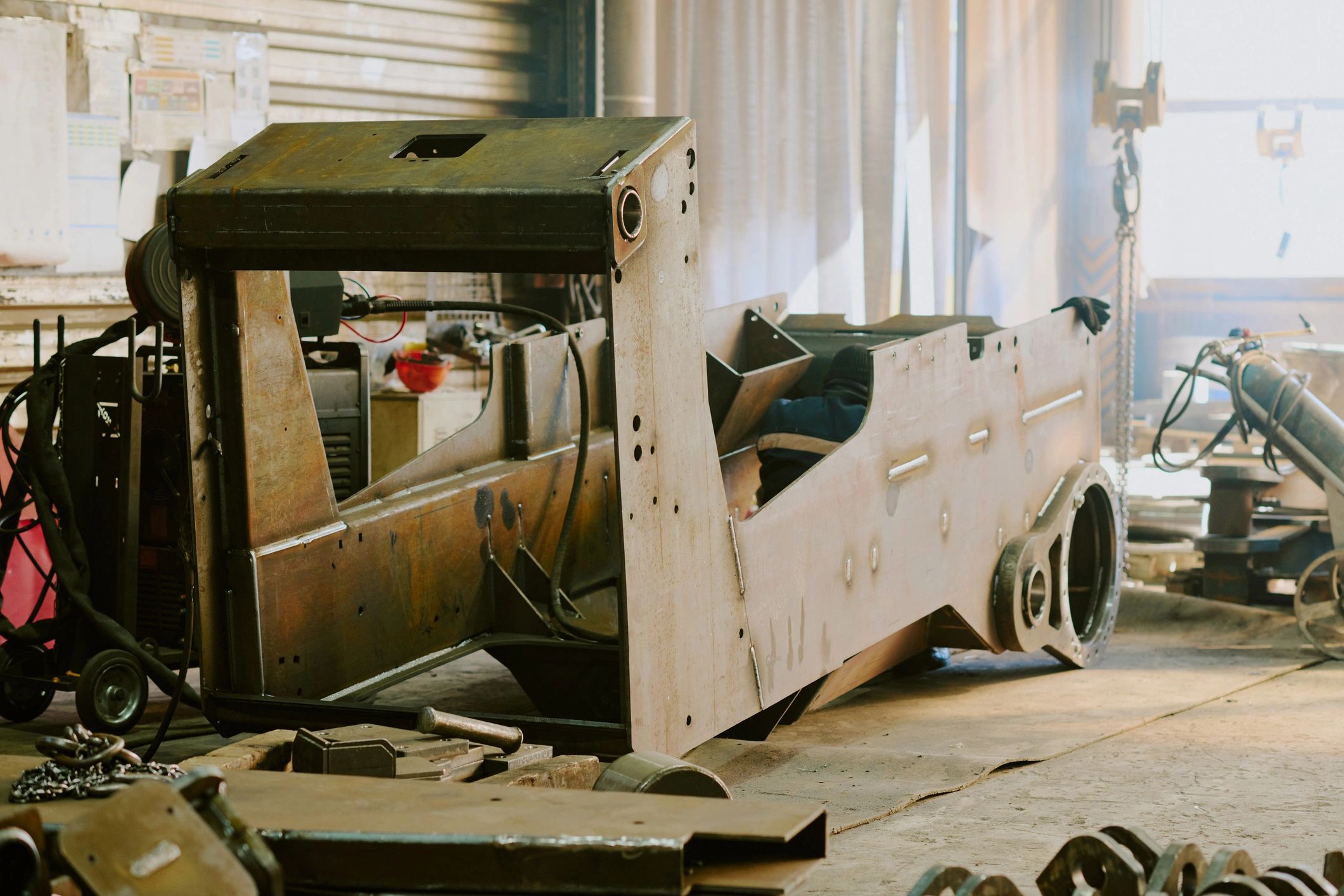 Fabricated industrial machine component in workshop