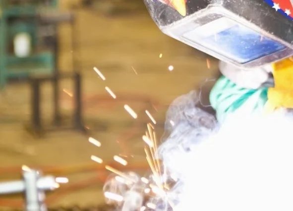 Luft Machine fabricator welding in the shop